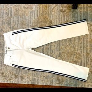 White skinny jeans by INC. Tuxedo black stripe for a slimming look. Size 6.